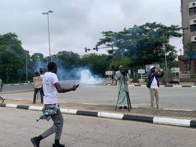 Police Shoot Tear Gas At #EndBadGovernanceInNigeria Protesters In Kano